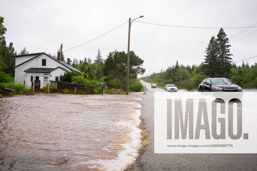 Vehicles drive along Old Route 4 in flood water conditions, in Richmond County, Cape Breton, N.S., Saturday, Sept. 5, 2026. Richmond County CANADA - ZUMAc35_ 20260905_zaf_c35_043