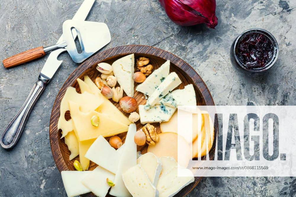 Cheese on the table.various types of cheese on old rustic wooden table