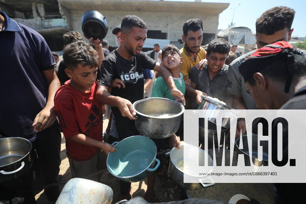 Displaced Palestinians receive free meals amid shortages in Gaza City Displaced Palestinians receive free meals distributed in western Gaza City, in the Gaza Strip, on September 9, 2026. The distribution comes amid difficult humanitarian conditions and shortages of food and basic necessities as war and displacement continue across the Gaza Strip. Photo by Hassan al-Jedi apaimages Nusairat Gaza Strip Palestinian Territory 090926_Gaza_HJ_00(21).jpeg