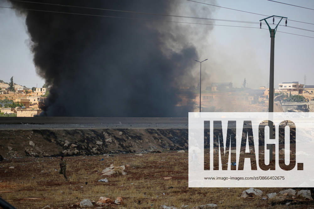 4 killed in explosion in Syria s Idlib province IDLIB, SYRIA - SEPTEMBER 09: Smoke rises after a powerful explosion, the cause of which has not yet been determined, at a warehouse where war remnant munitions were being collected near the Sarmada district of Idlib province in northwestern Syria on September 09, 2026. Police, ambulance, firefighting, and civil defense teams were dispatched to the area. Kasim Yusuf Anadolu Idlib Syria. Editorial use only. Please get in touch for any other usage.