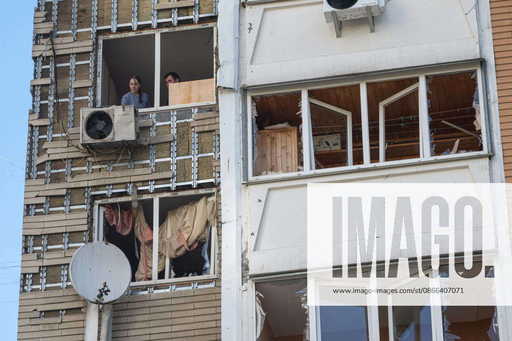 A man and a woman stand in a shattered window in a 24-storey apartment block damaged by a Russian attack in the Darnytskyi district of Kyiv, Ukraine, September 9, 2026. On Wednesday morning, September 9, a Russian drone hit the 24-storey building on the 12th floor. According to police, five people were injured, including a pregnant woman. (Photo by Danylo Antoniuk Ukrinform) Apartment block hit by Russian drone in Kyiv