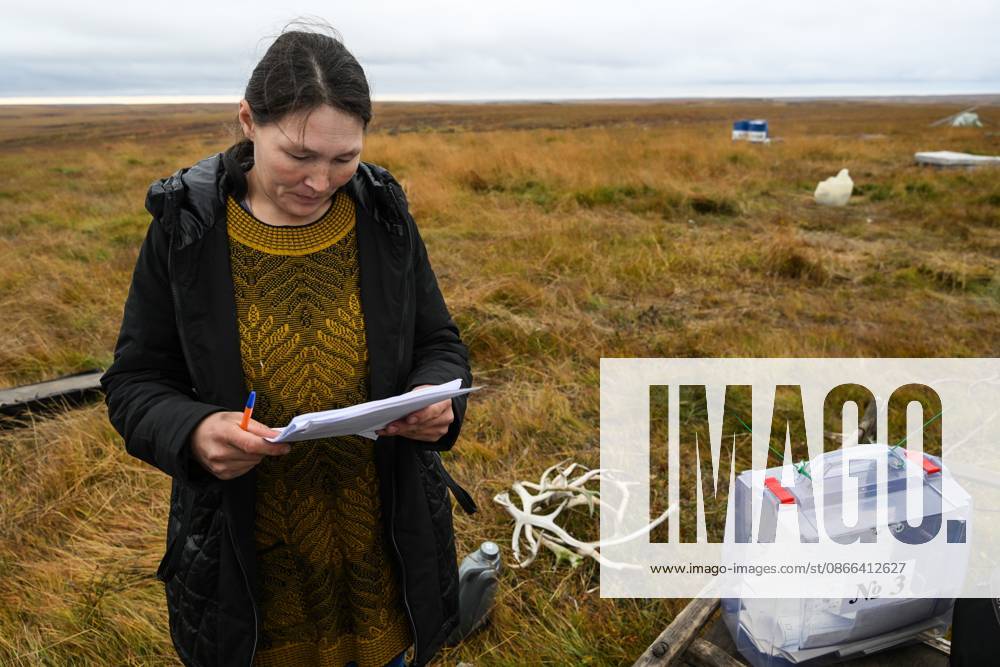 Russia Parliamentary Election Early Voting 9239437 09.09.2026 A member of a local indigenous community reads a ballot during the early voting in remote areas ahead of State Duma elections at a reindeer camping ground, in Yamalo-Nenets Autonomous Area, Russia. Russians will vote in State Duma, the lower house of parliament, and municipal elections over three days, from September 18-20. Alexandr Kryazhev Sputnik Yamalo-Nenets Autonomous Area Russia