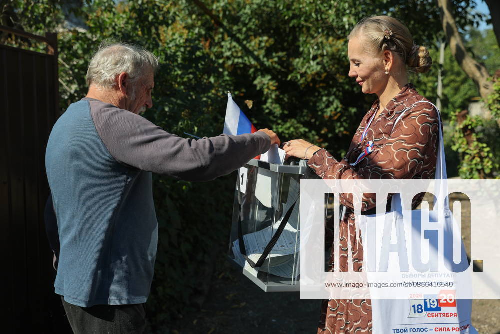 RUSSIA, DONETSK - SEPTEMBER 9, 2026: Citizens participate in early voting in the 2026 State Duma elections in Oktyabrsky. Dmitry Yagodkin TASS 97412816
