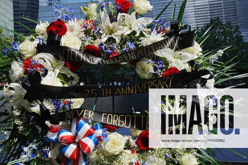 A memorial and flower arrangement to the NYPD along the South Tower reflecting pool ahead of the 25th anniversary of the attacks of September 11 at the 9 11 Memorial on September 9, 2026 in New York. New York USA - ZUMAb148 20260909_zap_b148_008