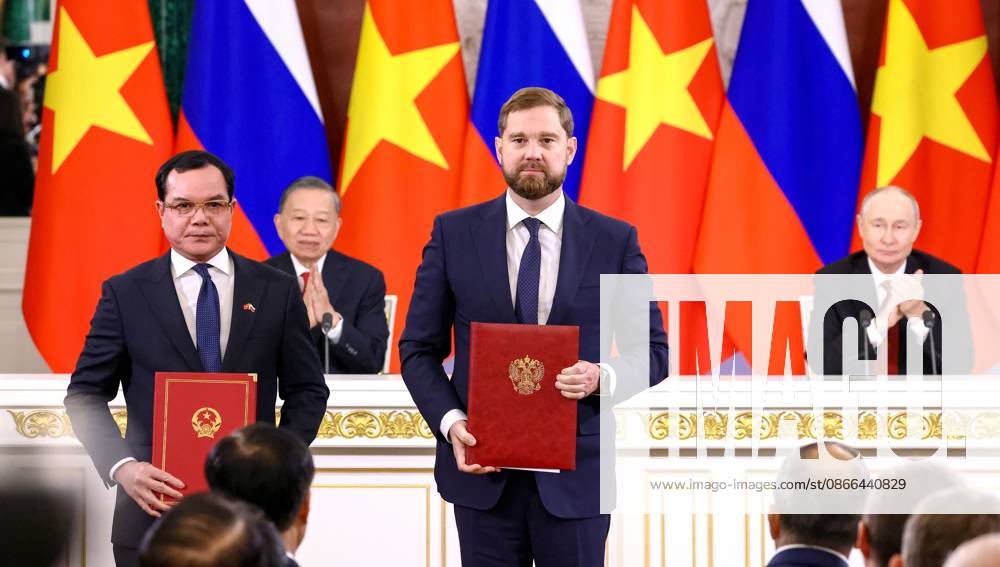 Russia Vietnam 9239810 09.09.2026 Vietnamese Minister of Ethnic Minorities and Religions Nguyen Dinh Khang and Head of the Russian Federal Agency for Ethnic Affairs Igor Barinov exchange signed documents following a meeting between Russian President Vladimir Putin and Vietnamese President To Lam at the Kremlin in Moscow, Russia. Geodakyan Artem Sputnik Moscow Russia