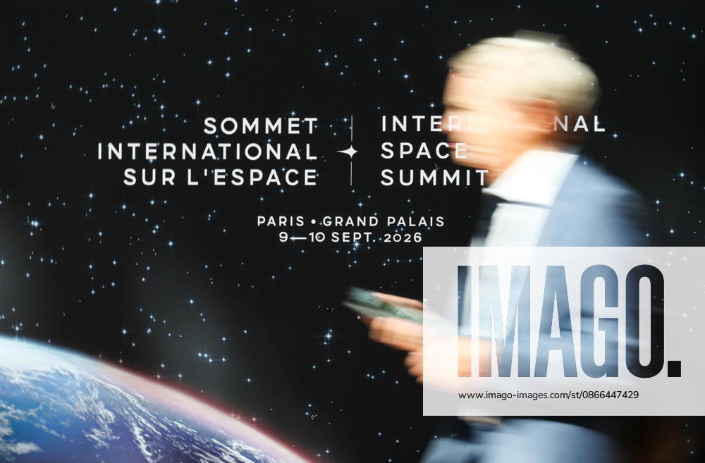 (260909) -- PARIS, Sept. 9, 2026 -- A visitor passes the logo of the International Space Summit at the Grand Palais in Paris, France, Sept. 9, 2026. The first International Space Summit opened Wednesday in Paris, bringing together heads of state and government, scientists, astronauts and industry representatives. ) FRANCE-PARIS-INTERNATIONAL SPACE SUMMIT WuxHuiwo