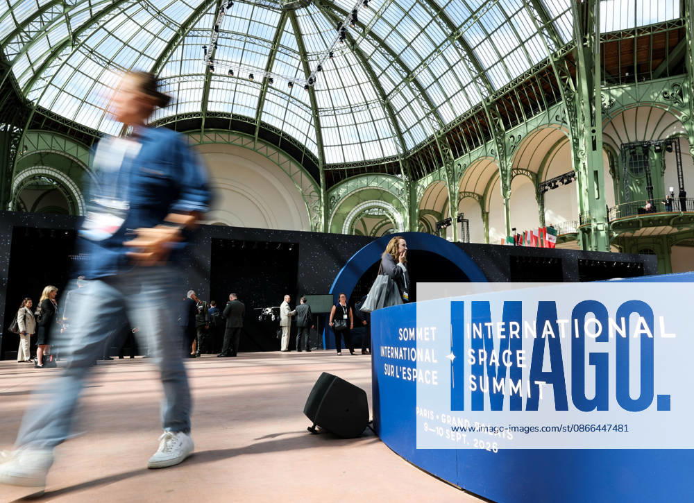 (260909) -- PARIS, Sept. 9, 2026 -- A visitor passes the logo of the International Space Summit at the Grand Palais in Paris, France, Sept. 9, 2026. The first International Space Summit opened Wednesday in Paris, bringing together heads of state and government, scientists, astronauts and industry representatives. ) FRANCE-PARIS-INTERNATIONAL SPACE SUMMIT WuxHuiwo