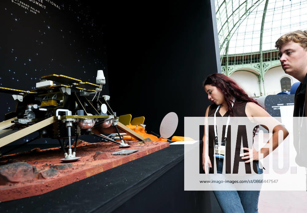 (260909) -- PARIS, Sept. 9, 2026 -- Visitors check an exhibit during the International Space Summit at the Grand Palais in Paris, France, Sept. 9, 2026. The first International Space Summit opened Wednesday in Paris, bringing together heads of state and government, scientists, astronauts and industry representatives. ) FRANCE-PARIS-INTERNATIONAL SPACE SUMMIT WuxHuiwo