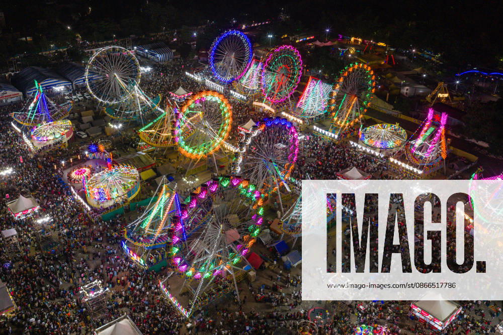 The Rajkot Lok Mela attracts over a million visitors and features ferris wheels and carnival rides set against the city skyline during the day. At night, the event glows with lights, on September 10, 2026 in Rajkot, Gujarat, India. Rajkot India - ZUMAs263 20260910_zip_s263_032