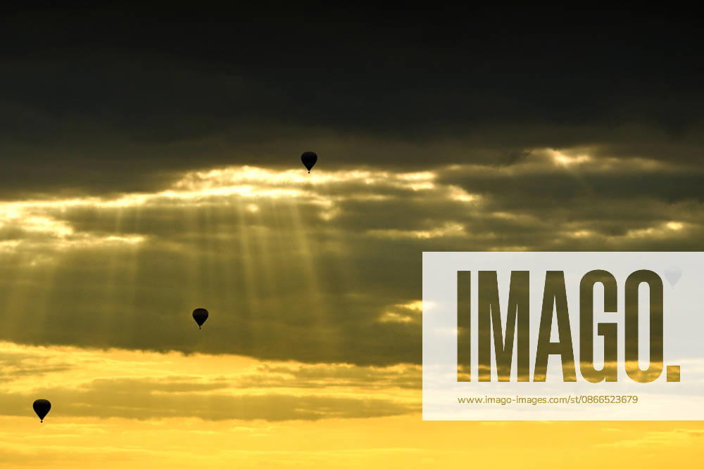 Hot air balloons drift through the sky as the sun sets over the Czech Paradise on a September day in the Czech Republic. Sobotka Czech Republic - ZUMAr156 20260910_aap_r156_001