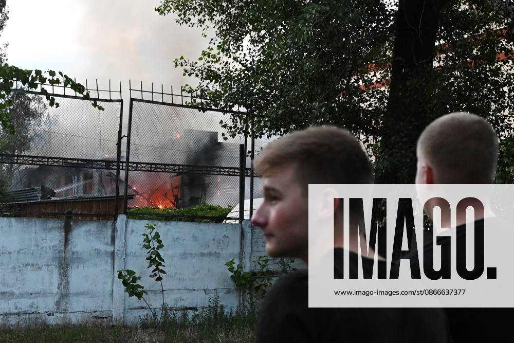 Russian Air Attack On Kyiv, Ukraine People stand near the fire after a jet-powered drone struck an office building in the Podilskyi district of Kyiv, on September 11, 2026. Kyiv Ukraine