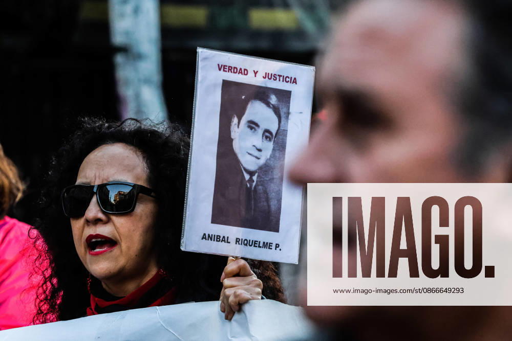 Demonstration march in commemoration of the 53rd anniversary of the coup d Ètat in ValparaÌso, Chile - 9 Sept 2026 A protester holds a placard featuring a victim of forced disappearance during a demonstration march commemorating the 53rd anniversary of the coup d Ètat in ValparaÌso. Valparaiso Chile