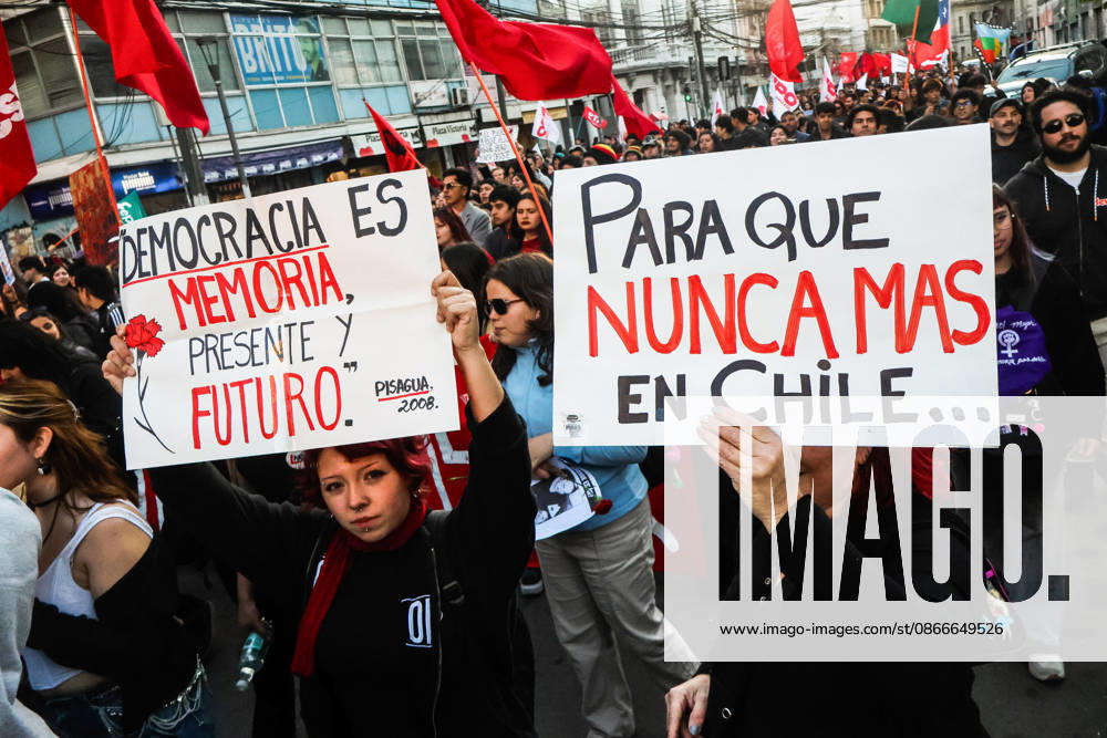 Protesters hold placards expressing their opinion during a demonstration march commemorating the 53rd anniversary of the coup d Ètat in ValparaÃaso. Valparaiso Chile - ZUMAs197 20260911_aaa_s197_417