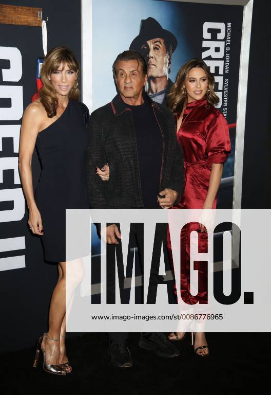 New York City, New York, U.S. - Actor SYLVESTER STALLONE with (L) JENNIFER FLAVIN and daughter (R) SCARLET ROSE STALLONE attend the World Premiere of Creed ll held at the AMC Lincoln Square Theater. New York City U.S. - ZUMAk03_ 20181114_zaf_k03_174