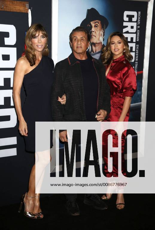 New York City, New York, U.S. - Actor SYLVESTER STALLONE with (L) JENNIFER FLAVIN and daughter (R) SCARLET ROSE STALLONE attend the World Premiere of Creed ll held at the AMC Lincoln Square Theater. New York City U.S. - ZUMAk03_ 20181114_zaf_k03_176