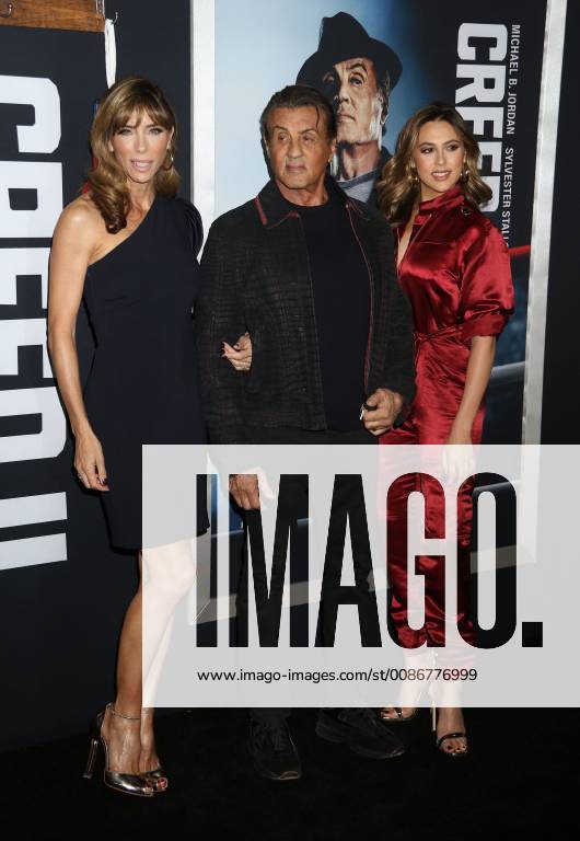 New York City, New York, U.S. - Actor SYLVESTER STALLONE with (L) JENNIFER FLAVIN and daughter (R) SCARLET ROSE STALLONE attend the World Premiere of Creed ll held at the AMC Lincoln Square Theater. New York City U.S. - ZUMAk03_ 20181114_zaf_k03_175