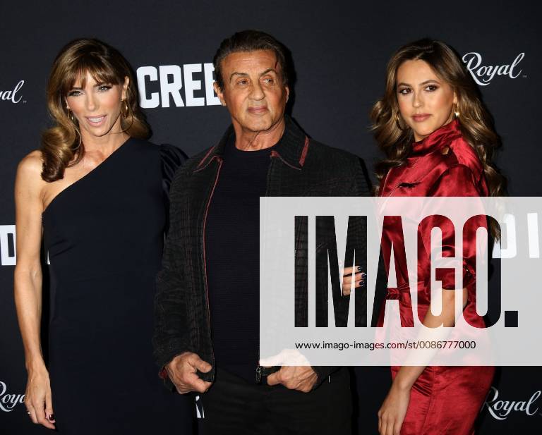 New York City, New York, U.S. - Actor SYLVESTER STALLONE with (L) JENNIFER FLAVIN and daughter (R) SCARLET ROSE STALLONE attend the World Premiere of Creed ll held at the AMC Lincoln Square Theater. New York City U.S. - ZUMAk03_ 20181114_zaf_k03_177