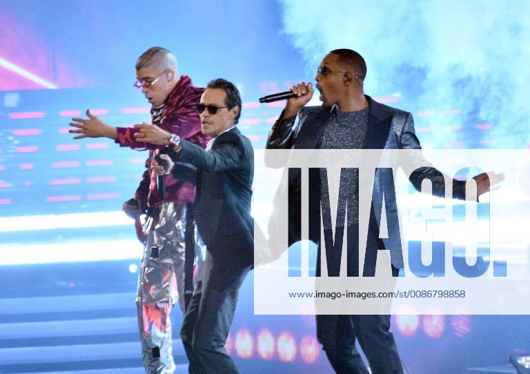 (L-R) Bad Bunny, Marc Anthony and Will Smith perform Esta Rico onstage during the 19th annual Latin Grammy Awards at the MGM Garden Arena in Las Vegas, Nevada on November 15, 2018. LAV20181115116 JIMxRUYMEN