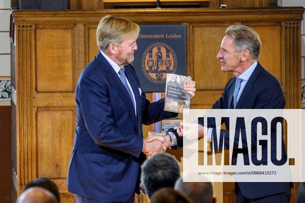Leiden, The Netherlands, 2026-10-02 11:59:30 LEIDEN, 02-10-2026, Leiden University. King Willem Alexander receives the results of the independent research into the role of the House of Orange-Nassau in the colonial history of the Netherlands in the Academy Building of Leiden University. Principal investigator Prof. Dr. Gert Oostindie presents the King with the five books on which approximately sixty researchers have worked over the past few years, including the comprehensive popular book *Oranje en de Koloniën, 1600-2025. De kolonie geschiedenis van het Huis Oranje-Nassau*. PHOTO: NLBeeld Patrick van Emst Credit: NL Beeld Patrick van Emst