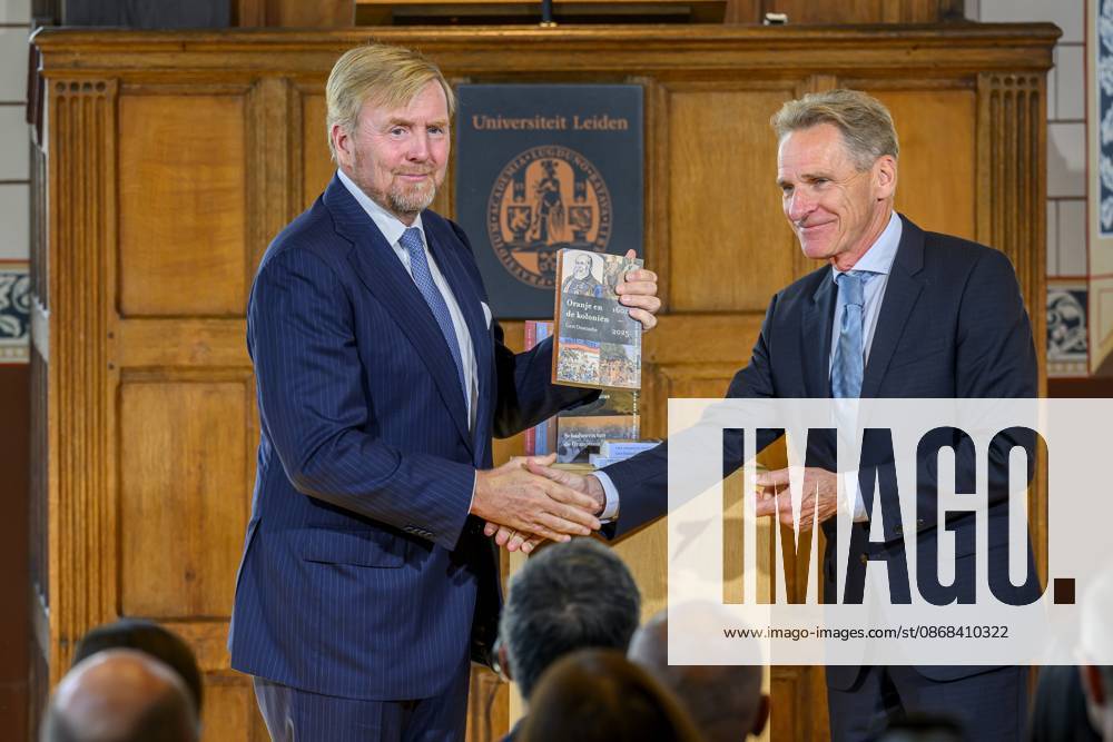 Leiden, The Netherlands, 2026-10-02 11:59:32 LEIDEN, 02-10-2026, Leiden University. King Willem Alexander receives the results of the independent research into the role of the House of Orange-Nassau in the colonial history of the Netherlands in the Academy Building of Leiden University. Principal investigator Prof. Dr. Gert Oostindie presents the King with the five books on which approximately sixty researchers have worked over the past few years, including the comprehensive popular book *Oranje en de Koloniën, 1600-2025. De kolonie geschiedenis van het Huis Oranje-Nassau*. PHOTO: NLBeeld Patrick van Emst Credit: NL Beeld Patrick van Emst