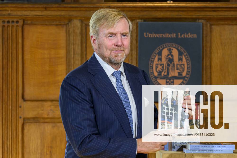 Leiden, The Netherlands, 2026-10-02 11:59:32 LEIDEN, 02-10-2026, Leiden University. King Willem Alexander receives the results of the independent research into the role of the House of Orange-Nassau in the colonial history of the Netherlands in the Academy Building of Leiden University. Principal investigator Prof. Dr. Gert Oostindie presents the King with the five books on which approximately sixty researchers have worked over the past few years, including the comprehensive popular book *Oranje en de Koloniën, 1600-2025. De kolonie geschiedenis van het Huis Oranje-Nassau*. PHOTO: NLBeeld Patrick van Emst Credit: NL Beeld Patrick van Emst