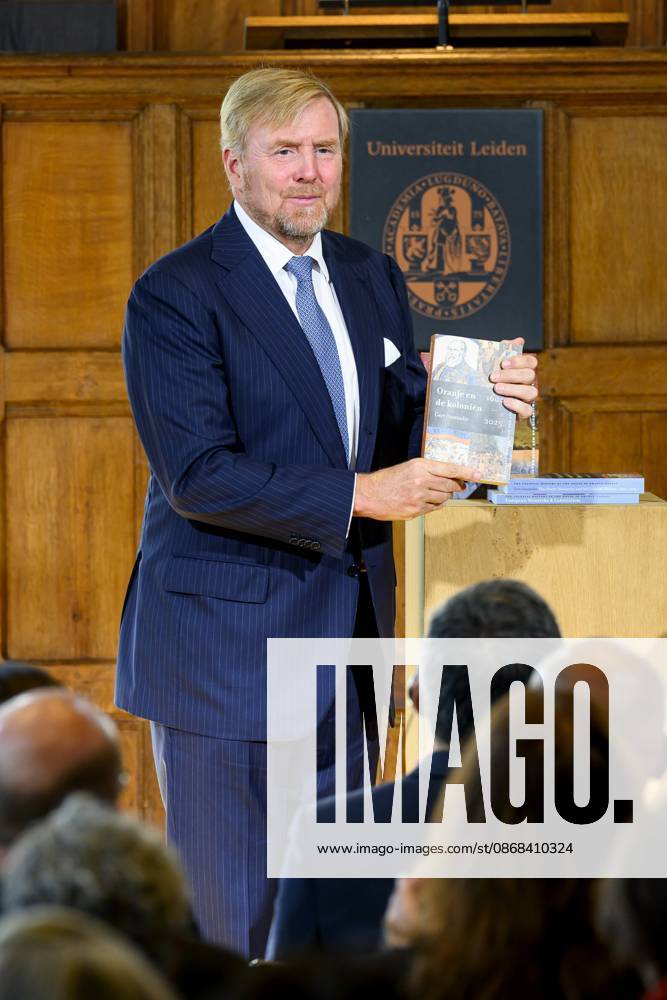 Leiden, The Netherlands, 2026-10-02 11:59:32 LEIDEN, 02-10-2026, Leiden University. King Willem Alexander receives the results of the independent research into the role of the House of Orange-Nassau in the colonial history of the Netherlands in the Academy Building of Leiden University. Principal investigator Prof. Dr. Gert Oostindie presents the King with the five books on which approximately sixty researchers have worked over the past few years, including the comprehensive popular book *Oranje en de Koloniën, 1600-2025. De kolonie geschiedenis van het Huis Oranje-Nassau*. PHOTO: NLBeeld Patrick van Emst Credit: NL Beeld Patrick van Emst