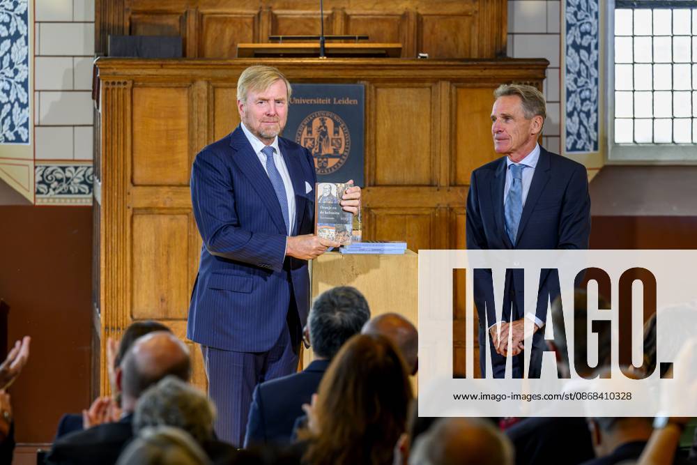 Leiden, The Netherlands, 2026-10-02 11:59:34 LEIDEN, 02-10-2026, Leiden University. King Willem Alexander receives the results of the independent research into the role of the House of Orange-Nassau in the colonial history of the Netherlands in the Academy Building of Leiden University. Principal investigator Prof. Dr. Gert Oostindie presents the King with the five books on which approximately sixty researchers have worked over the past few years, including the comprehensive popular book *Oranje en de Koloniën, 1600-2025. De kolonie geschiedenis van het Huis Oranje-Nassau*. PHOTO: NLBeeld Patrick van Emst Credit: NL Beeld Patrick van Emst
