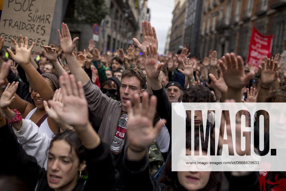 Protest in Madrid over the housing decree in Madrid, Spain - 02 Oct 2026 Protesters raise their hands while shouting during the demonstration. The protest in front of the Congress of Deputies in Madrid, demanding the approval of measures to address the housing and rental crisis in Spain. The demonstration was organized by protesters camping in Puerta del Sol in central Madrid. Madrid Spain