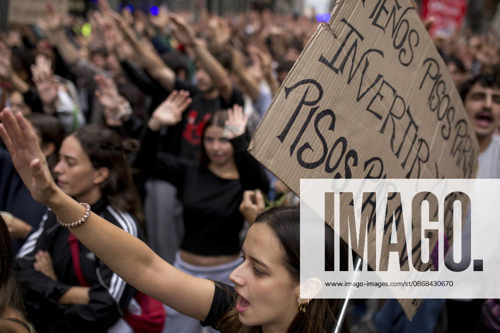 A protester raises her hand and shouts while holding a placard during the demonstration. The protest in front of the Congress of Deputies in Madrid, demanding the approval of measures to address the housing and rental crisis in Spain. The demonstration was organized by protesters camping in Puerta del Sol in central Madrid. Madrid Spain - ZUMAs197 20261002_aaa_s197_072