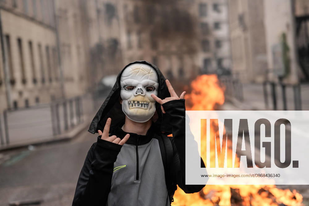 Students clash with police during high-school mobilization in Nancy NANCY, FRANCE - OCTOBER 2: A masked student is seen as flames rise from burning barricades erected by high school students during nationwide education protests in Nancy, France on October 2, 2026. Students gather around several schools and clash with police forces as a nationwide high-school mobilization continues over school conditions and demands for greater education resources in Nancy. Police deploy security units around several locations as demonstrations and blockades continue. Muhammed Said Tako Anadolu Nancy France. Editorial use only. Please get in touch for any other usage.