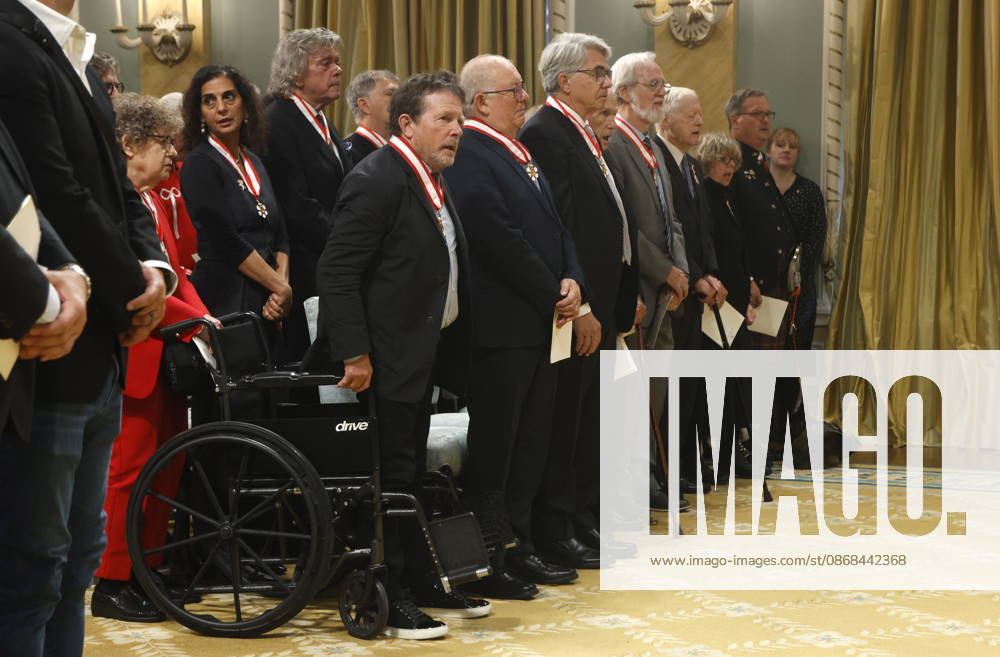 Actor Michael J. Fox, front, stands for the national anthem with other Order of Canada recipients at the end of an investiture ceremony at Rideau Hall in Ottawa, Friday, Oct. 2, 2026. Ottawa CANADA - ZUMAc35_ 20261002_zaf_c35_049