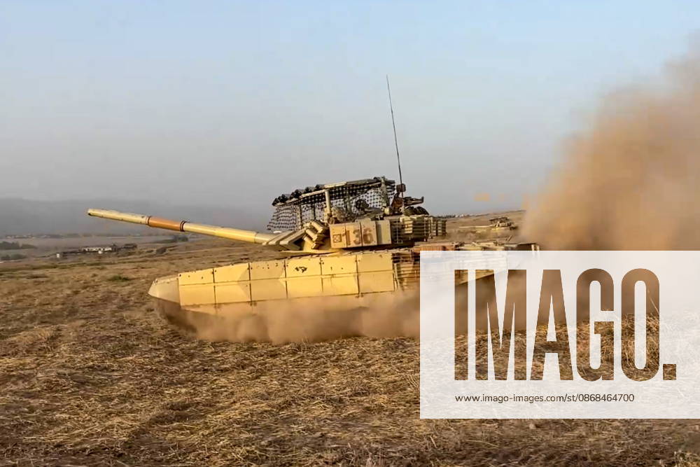 Russian tank crews destroy a simulated enemy during the Tsentr Centre 2026 military exercise held at the Lyaur training ground. Video screen grab. Best quality available. Russian Defence Ministry TASS 98708966