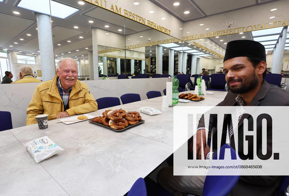 Open Mosque Day in Germany Open Mosque Day in Germany. A men from nuremberg and a muslim member smile together in the mosque Bait ur Rehman Moschee in Nuremberg, Germany . October 03rd , 2026 Photo by Davide Elias