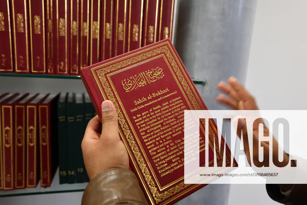 Open Mosque Day in Germany Open Mosque Day in Germany. A member shows a book in the mosque Bait ur Rehman Moschee in Nuremberg, Germany . October 03rd , 2026 Photo by Davide Elias