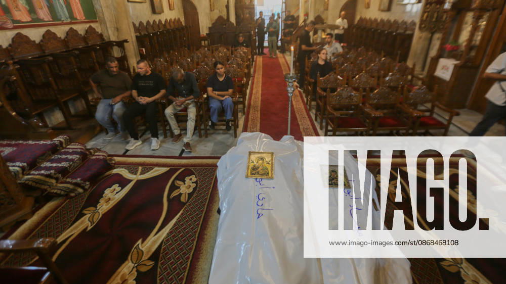 Gaza City, Gaza Strip, Palestinian Territory: Palestinian Christians gather to bid farewell and pray beside the bodies of Maysaa Abu Daoud and her daughter, Mary Abu Daoud, who were killed in an Israeli airstrike that targeted a residential apartment in western Gaza City. Funeral prayers are held at St. Porphyrios Church in the Zeitoun neighborhood of southeastern Gaza City. Gaza City Palestinian Territory - ZUMAz119 20261003_zip_z119_037