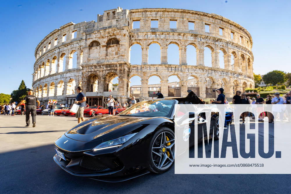 Ferrari Tour stops in Pula Luxury Ferrari sports cars taking part in a Ferrari Tour organized by Ineco Auto, are seen in front of the Roman Arena in Pula, Croatia, on October 3, 2026. While the drivers visit the ancient amphitheatre, local residents gather to watch and admire the vehicles. SreckoxNiketic PIXSELL