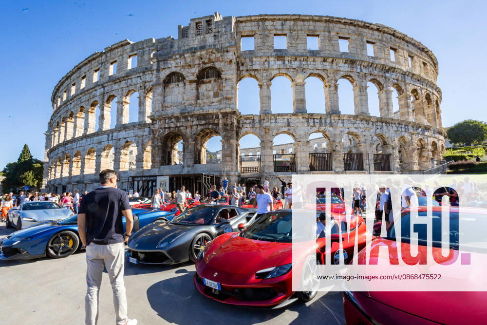 Ferrari Tour stops in Pula Luxury Ferrari sports cars taking part in a Ferrari Tour organized by Ineco Auto, are seen in front of the Roman Arena in Pula, Croatia, on October 3, 2026. While the drivers visit the ancient amphitheatre, local residents gather to watch and admire the vehicles. SreckoxNiketic PIXSELL