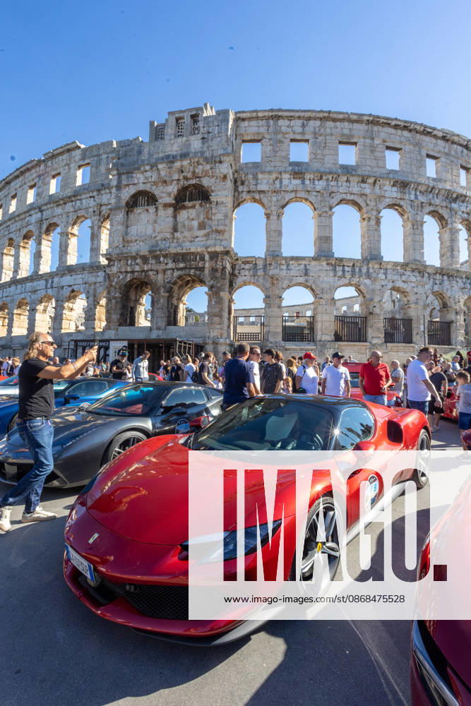 Ferrari Tour stops in Pula Luxury Ferrari sports cars taking part in a Ferrari Tour organized by Ineco Auto, are seen in front of the Roman Arena in Pula, Croatia, on October 3, 2026. While the drivers visit the ancient amphitheatre, local residents gather to watch and admire the vehicles. SreckoxNiketic PIXSELL