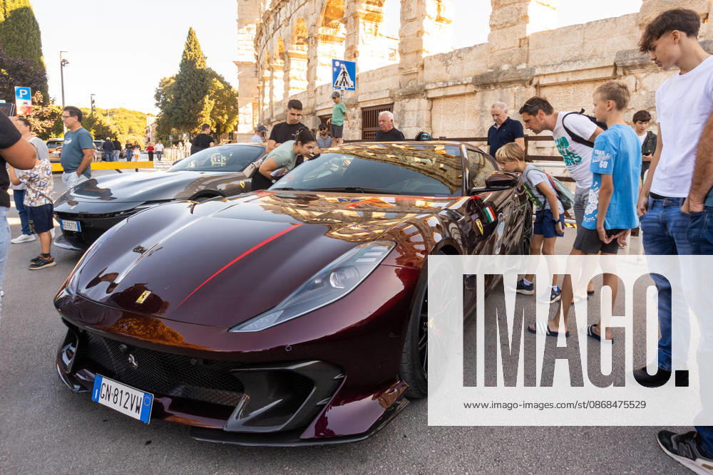 Ferrari Tour stops in Pula Luxury Ferrari sports cars taking part in a Ferrari Tour organized by Ineco Auto, are seen in front of the Roman Arena in Pula, Croatia, on October 3, 2026. While the drivers visit the ancient amphitheatre, local residents gather to watch and admire the vehicles. SreckoxNiketic PIXSELL