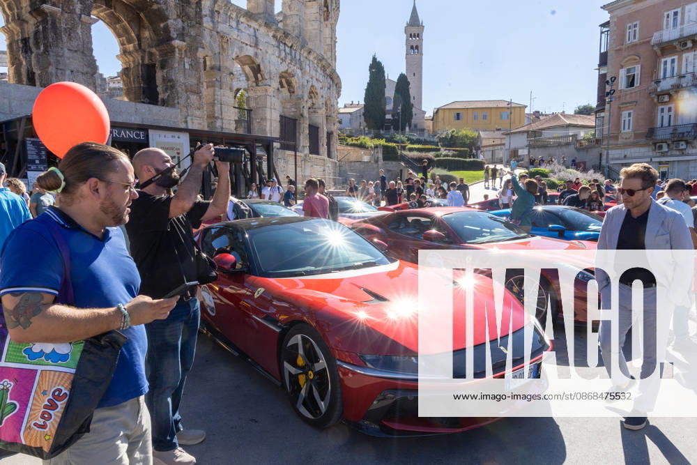 Ferrari Tour stops in Pula Luxury Ferrari sports cars taking part in a Ferrari Tour organized by Ineco Auto, are seen in front of the Roman Arena in Pula, Croatia, on October 3, 2026. While the drivers visit the ancient amphitheatre, local residents gather to watch and admire the vehicles. SreckoxNiketic PIXSELL