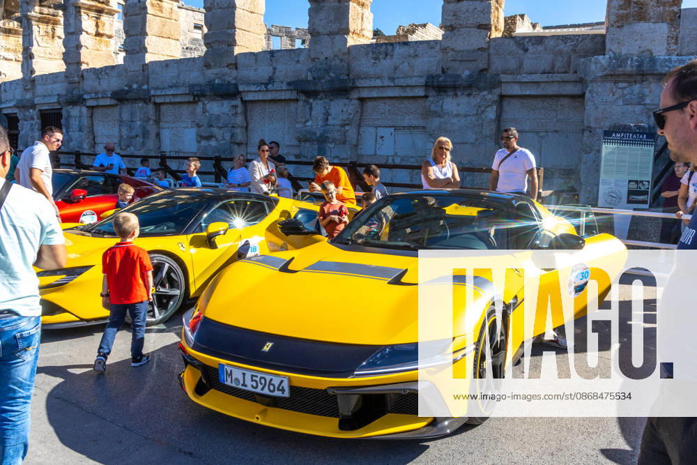 Ferrari Tour stops in Pula Luxury Ferrari sports cars taking part in a Ferrari Tour organized by Ineco Auto, are seen in front of the Roman Arena in Pula, Croatia, on October 3, 2026. While the drivers visit the ancient amphitheatre, local residents gather to watch and admire the vehicles. SreckoxNiketic PIXSELL