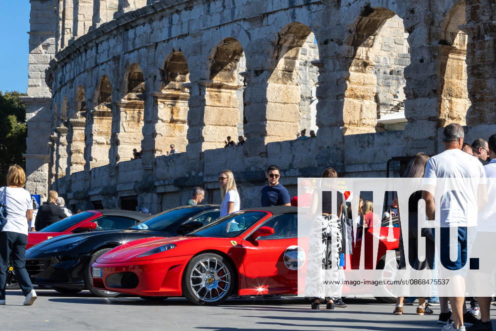 Ferrari Tour stops in Pula Luxury Ferrari sports cars taking part in a Ferrari Tour organized by Ineco Auto, are seen in front of the Roman Arena in Pula, Croatia, on October 3, 2026. While the drivers visit the ancient amphitheatre, local residents gather to watch and admire the vehicles. SreckoxNiketic PIXSELL