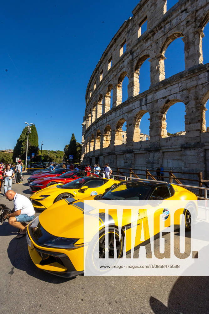 Ferrari Tour stops in Pula Luxury Ferrari sports cars taking part in a Ferrari Tour organized by Ineco Auto, are seen in front of the Roman Arena in Pula, Croatia, on October 3, 2026. While the drivers visit the ancient amphitheatre, local residents gather to watch and admire the vehicles. SreckoxNiketic PIXSELL