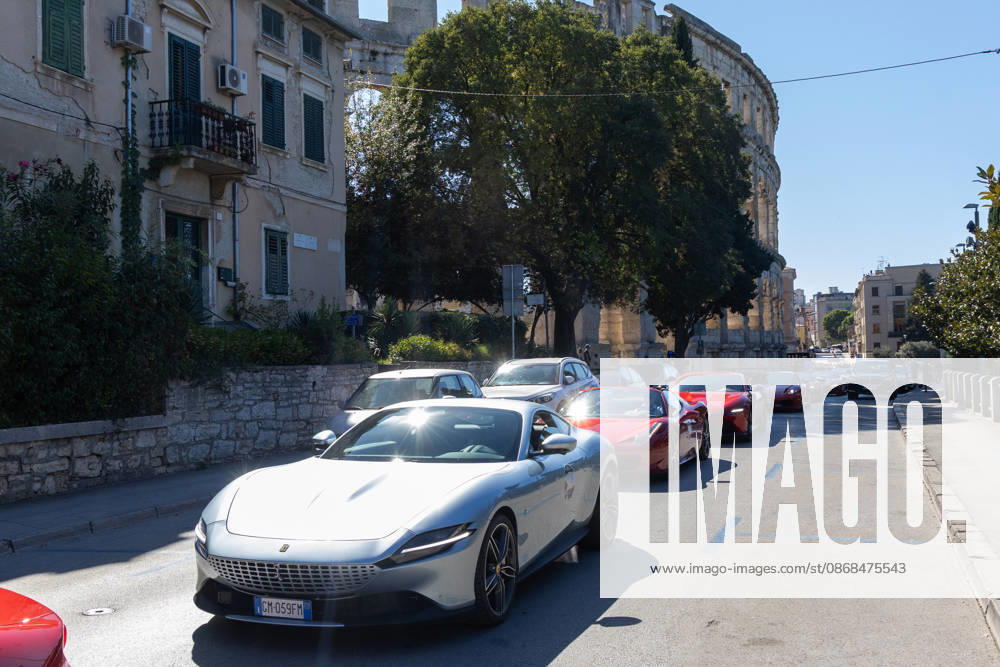 Ferrari Tour stops in Pula Luxury Ferrari sports cars taking part in a Ferrari Tour organized by Ineco Auto, are seen in front of the Roman Arena in Pula, Croatia, on October 3, 2026. While the drivers visit the ancient amphitheatre, local residents gather to watch and admire the vehicles. SreckoxNiketic PIXSELL