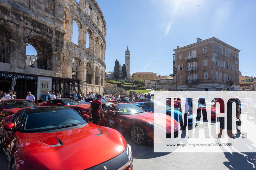 Ferrari Tour stops in Pula Luxury Ferrari sports cars taking part in a Ferrari Tour organized by Ineco Auto, are seen in front of the Roman Arena in Pula, Croatia, on October 3, 2026. While the drivers visit the ancient amphitheatre, local residents gather to watch and admire the vehicles. SreckoxNiketic PIXSELL