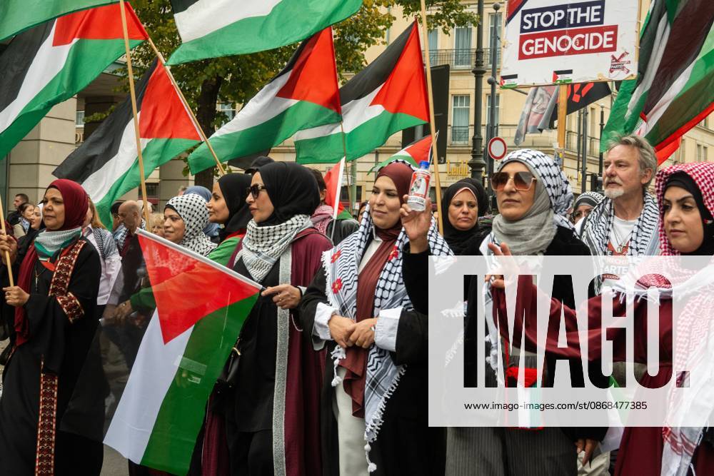 Palestinian and Pro-Palestinian Bloc at Berlin Peace Demonstration BERLIN, GERMANY OCTOBER 3, 2026: Thousands of people took part in a peace demonstration in central Berlin on German Unity Day. A coalition of peace initiatives, trade unions, and political and civil-society groups organized the protest. The demonstrators focused on military rearmament, the possible reintroduction of conscription, and Germanys military policy. The march began at the Brandenburg Gate and continued through the government district before concluding with a rally. The demonstration brought together participants expressing opposition to Germanys current and proposed military policies on a national public holiday. Berlin Germany