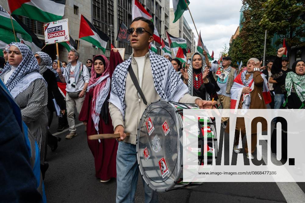 Palestinian and Pro-Palestinian Bloc at Berlin Peace Demonstration BERLIN, GERMANY OCTOBER 3, 2026: Thousands of people took part in a peace demonstration in central Berlin on German Unity Day. A coalition of peace initiatives, trade unions, and political and civil-society groups organized the protest. The demonstrators focused on military rearmament, the possible reintroduction of conscription, and Germanys military policy. The march began at the Brandenburg Gate and continued through the government district before concluding with a rally. The demonstration brought together participants expressing opposition to Germanys current and proposed military policies on a national public holiday. Berlin Germany