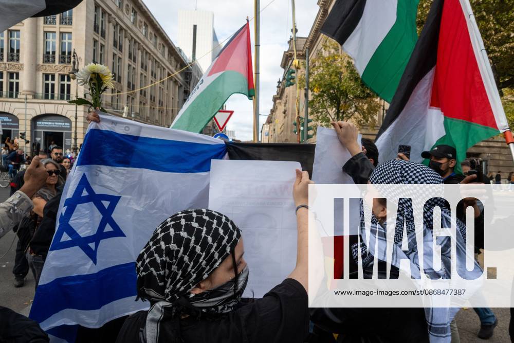 Palestinian and Pro-Palestinian Bloc at Berlin Peace Demonstration BERLIN, GERMANY OCTOBER 3, 2026: Thousands of people took part in a peace demonstration in central Berlin on German Unity Day. A coalition of peace initiatives, trade unions, and political and civil-society groups organized the protest. The demonstrators focused on military rearmament, the possible reintroduction of conscription, and Germanys military policy. The march began at the Brandenburg Gate and continued through the government district before concluding with a rally. The demonstration brought together participants expressing opposition to Germanys current and proposed military policies on a national public holiday. Berlin Germany