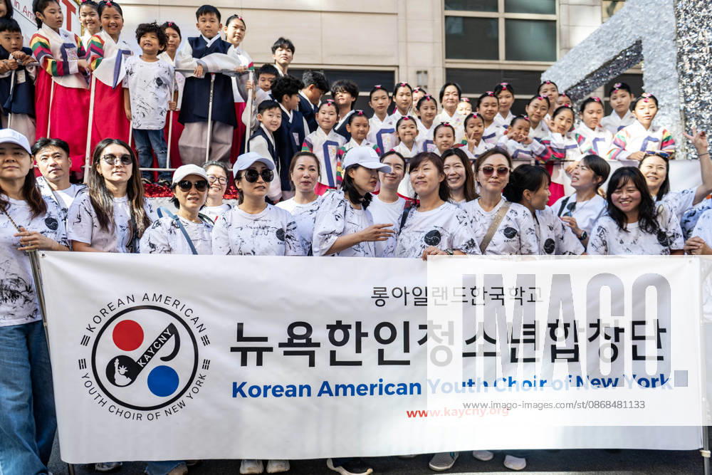 Particiants from the Korean American Youth Choir pose for a photo on their float. New York USA - ZUMAh214 20261003_znp_h214_008