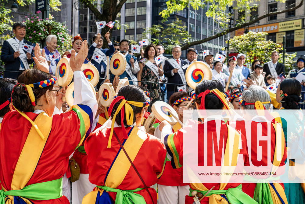 Participants at the 2026 NYC Korean Parade play drums and perform a traditional Korean dance during the parade. New York USA - ZUMAh214 20261003_znp_h214_005